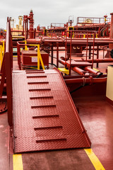 Safety ladder on deck of a crude oil tanker - stock photo