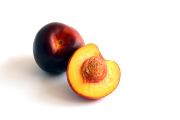 Whole Nectarine and one Sliced Open to Reveal the Stone