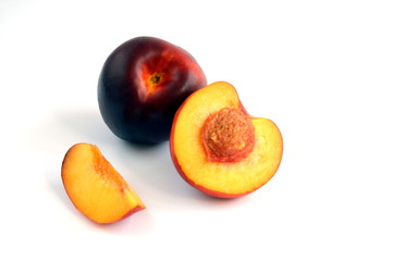 Whole Nectarine and one Sliced Open to Reveal the Stone