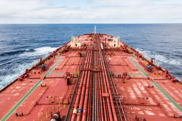 Oil carrier red deck with pipes, under cloudy sky, soft lighted. - stock photo © momentscatcher