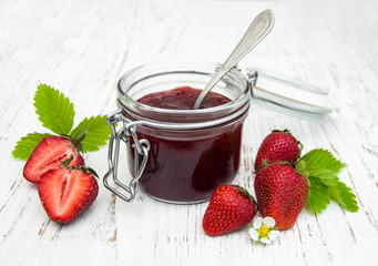 Strawberry jam and fresh strawberries