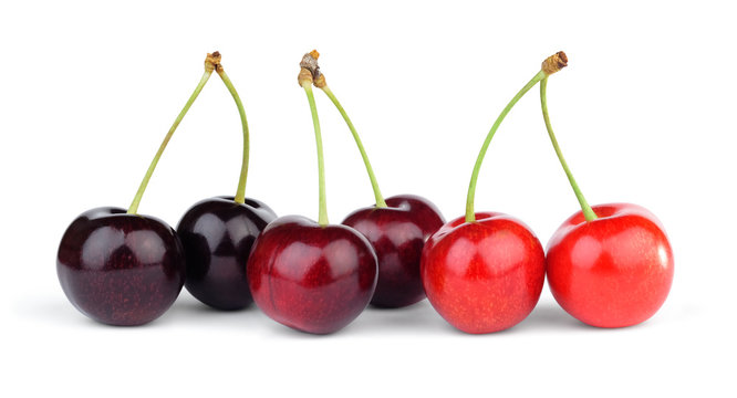 Three pairs of different varieties of cherries on stalk.