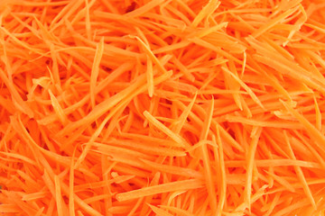 The orange carrot is cut into strips