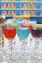 Glass of fruit drinks on table