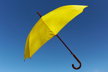 Yellow umbrella on the sky