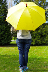 Young woman under umbrella