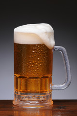 Beer Mug on Wet Wood Surface