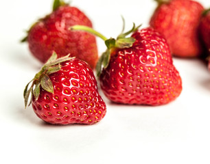 fresh organic strawberry over white background. fruit