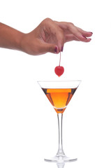 Woman Holding Cherry Over Drink