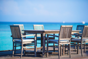 Fototapeta na wymiar Summer empty outdoor cafe on exotic shore