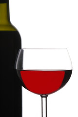 Red Wine Glass in Front of Bottle