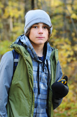 teen boy hiking with a gps unit