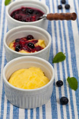 Banana Vanilla Pudding with Blueberry Compote. Selective focus.
