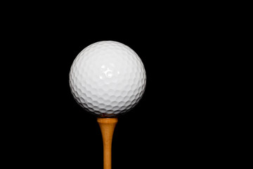 Golf Ball on Tee-Peg on black background