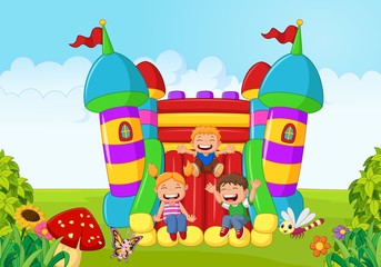 Obraz premium Cartoon little kid playing slide on the inflatable balloon