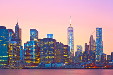 Naklejka premium New York City, financial district buildings in downtown Manhattan at sunset