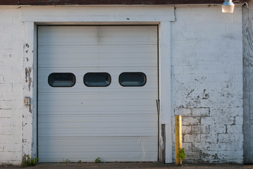 Faded Brick Walls And Old Garage Door