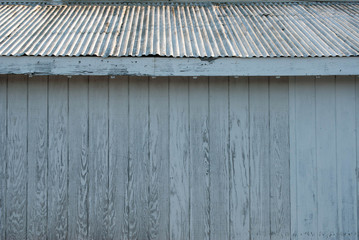 Faded Wall And Tin Roof Of Aged Structure