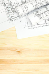 architect's workspace with rolls and plans