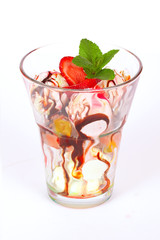 big glass with different flavors of ice cream, strawberries