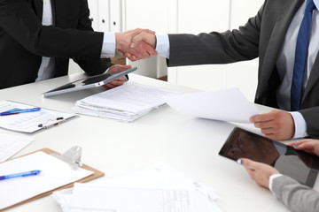 Closeup of a business handshake, on white background