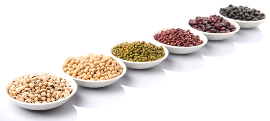 Beans variety in white bowl over white background