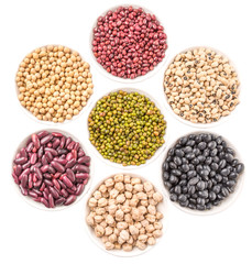 Beans variety in white bowl over white background