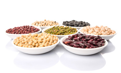 Beans variety in white bowl over white background