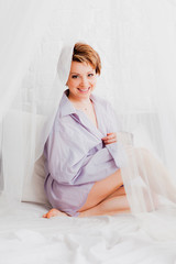 Young lovely  woman in man's shirt  © OlgaKhorkova