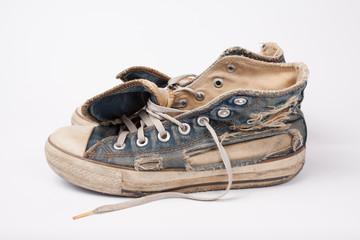 Old & Torn shoes isolated on white background