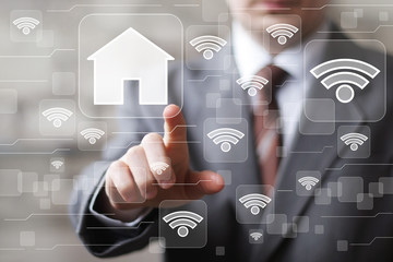 Man with touchscreen house network wifi sign