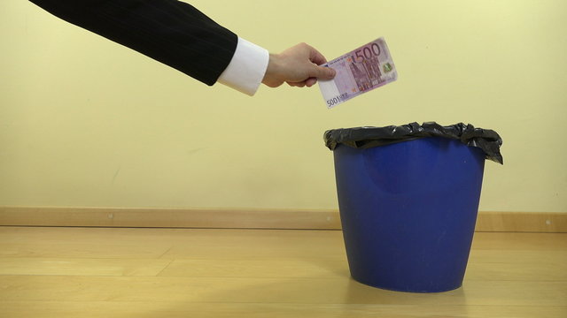 business man hand drop cash euro money banknotes in can bin. 4K