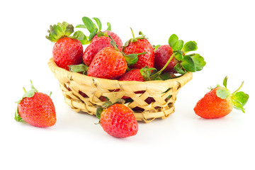 Handful of strawberries in a wicker basket