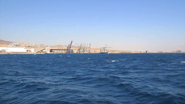 Tracking shot of the Port of Eilat
Long shot  that filmed from a boat.
Eilat is Israel's southern city, a popular resort, located at the northern tip of the Red Sea, on the Gulf of Eilat