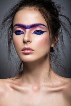 Fashion model with bright make-up art  and solid eyebrow