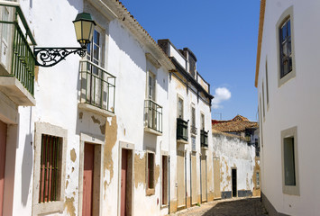 Fototapeta na wymiar Traditional street in old town of Faro - Capital of Algarve - Portugal, Europe