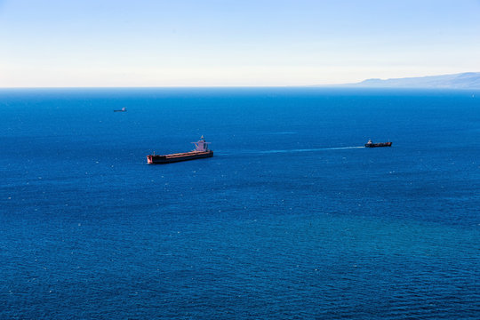 Container cargo ship and vessels in ocean