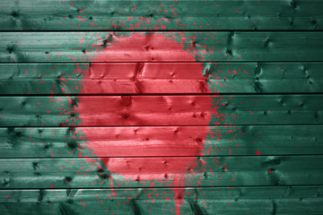 painted bangladesh flag on a wooden texture