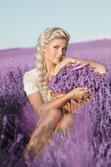 Beautiful young girl lavender flowers field