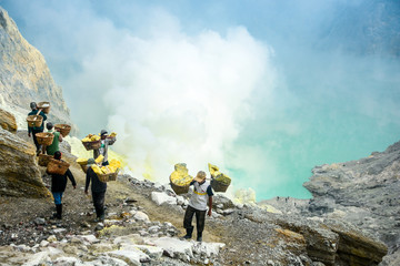 Sulfur miners in Kawah Ijen, Java, Indonesia