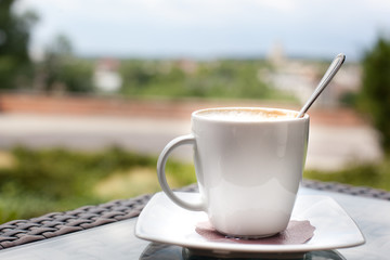 Cup of coffee on the balcony. Relax concept
