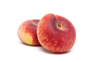 ripe peaches close-up on a white background