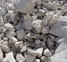 large white concrete chunks stacked in a pile