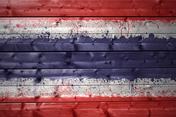 painted thailand flag on a wooden texture