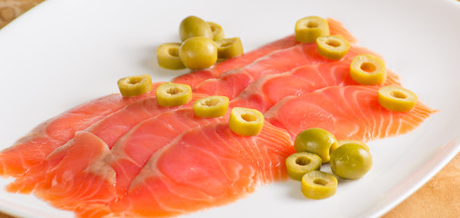 Salmon served with olive
