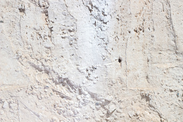 Light concrete wall with holes
