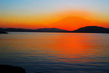 Fototapeta premium orange sunset in Alghero on a clear day,