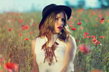 Beautiful girl in a summer field