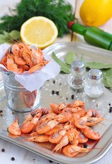 Fresh shrimps with salt and peppers on a bucket