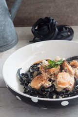 Carbonara squid ink with sausages